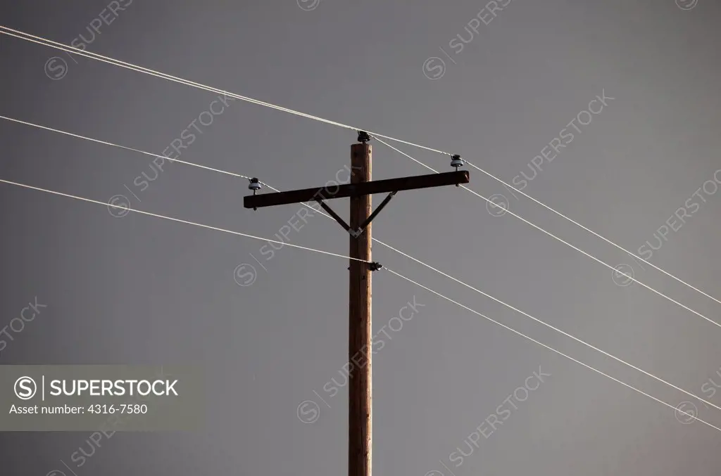 Power lines and power pole after the passage of a powerful thunderstorm