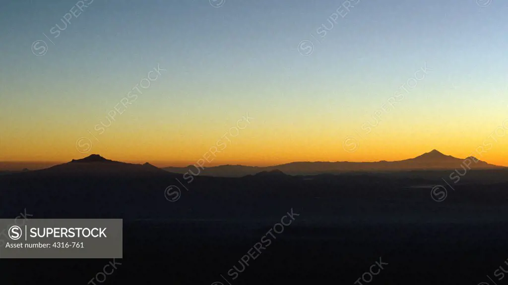 Dawn Light Silhouettes the Conical Forms of the Mexican Volcanoes La Malinche and Pico De Orizaba