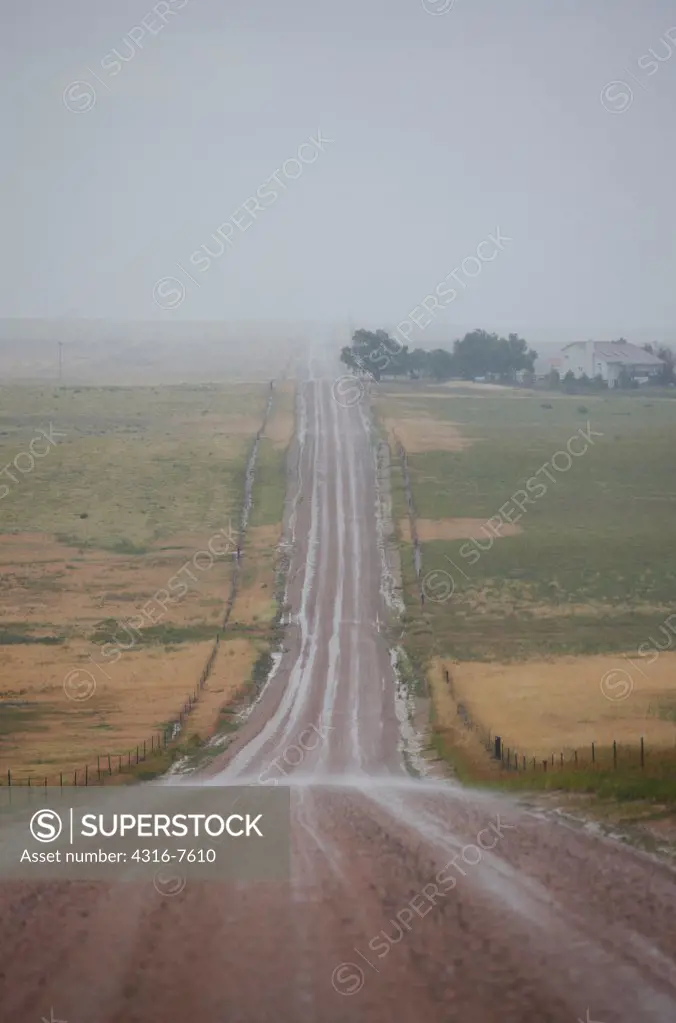 Country dirt road during a rain storm, Colorado