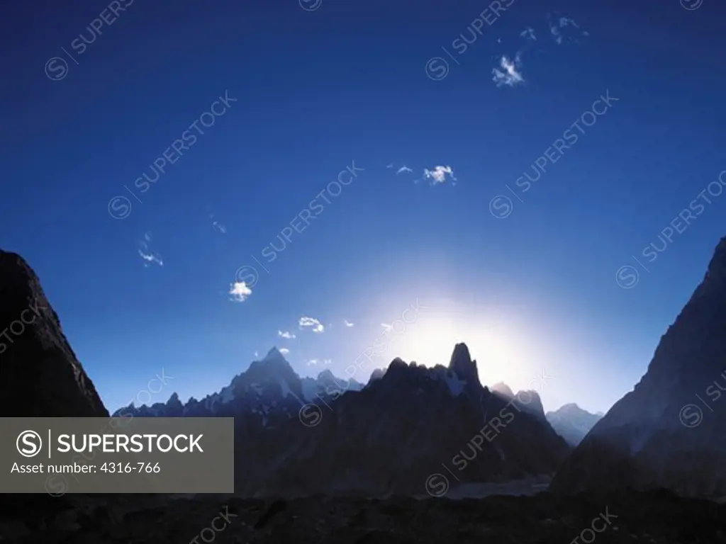 The Setting Sun Silhouettes Peaks of the Baltoro Glacier Including Paiju Peak and the Trango Towers Group