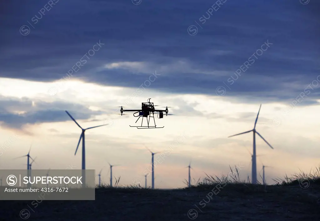 USA, Colorado, Unmanned aerial vehicle (UAV) or drone, flying past wind farm