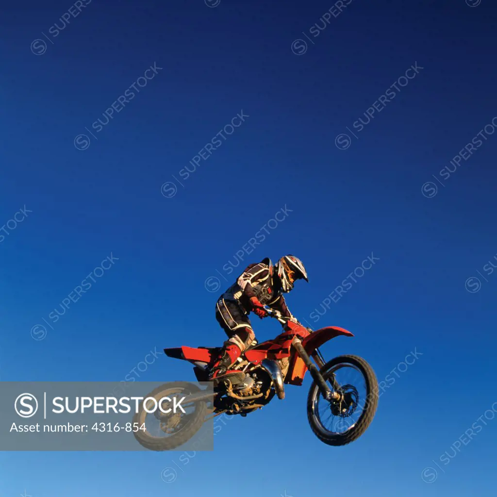 A Dirt Bike Rider Concentrates on the Quickly Approaching Earth