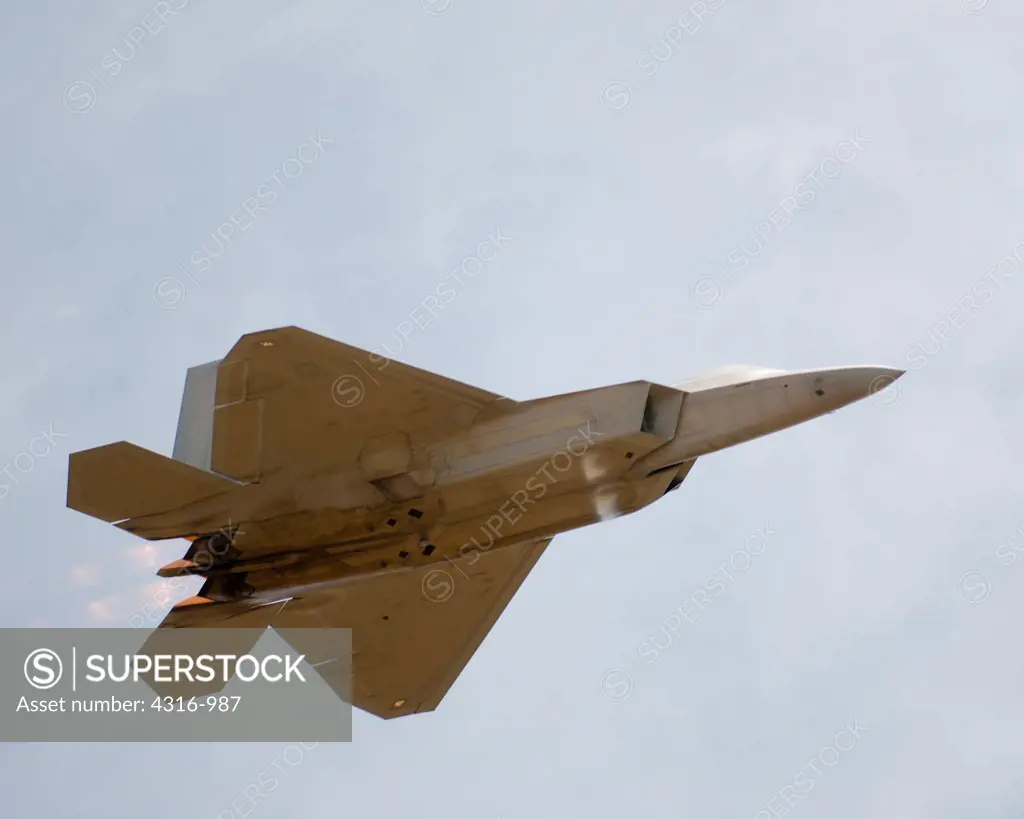 US Air Force F-22 Raptor Roars Through The Sky Under Full Afterburner