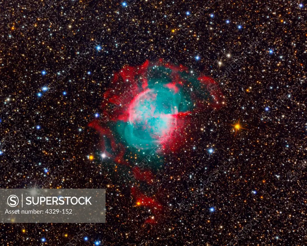 One of the best and first examples of a planetary nebula, M27 is about 2000 light years from Earth. In this very deep and colorful image we see the green of the ionized oxygen and the red of the hydrogen. M27 lies in the plane of the Milky Way; note the star colors surrounding it.