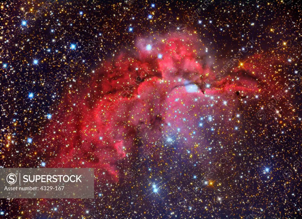 NGC 7380 is the designation for an open cluster discovered by Caroline Herschel, sister of William, in 1787; the emission nebula (red) is Sh2-142. This nebula lies in the constellation Cepheus and is 7000 light years distant. Note the star colors. 