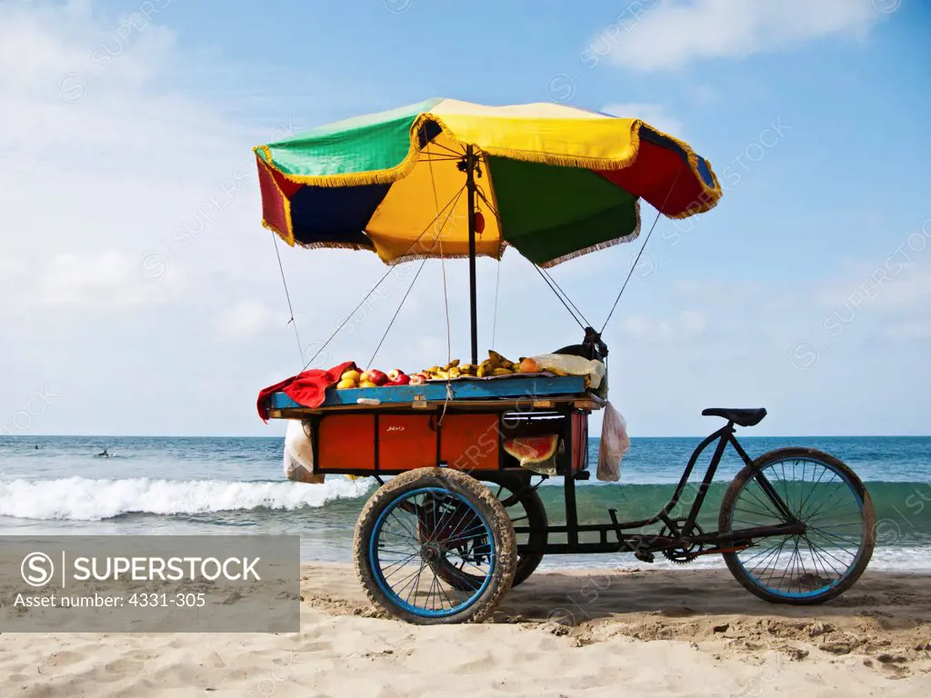 Assortment of Fruit Rests on Bike Tray on the Beach in Mancora, Peru