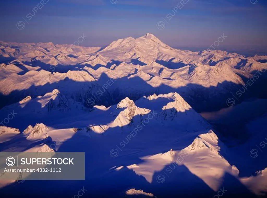 Aerial view of the Chigmit Mountains, Crescent Lake and Redoubt Volcano in early winter, Lake Clark National Park, Alaska.