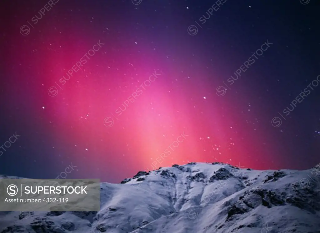 The Northern Light's auroral colors are produced when charged solar particles strike single atoms of oxygen at altitudes between 60 and 600 miles. This display occurred during a geomagnetic storm in the early evening hours of November 6, 2001.