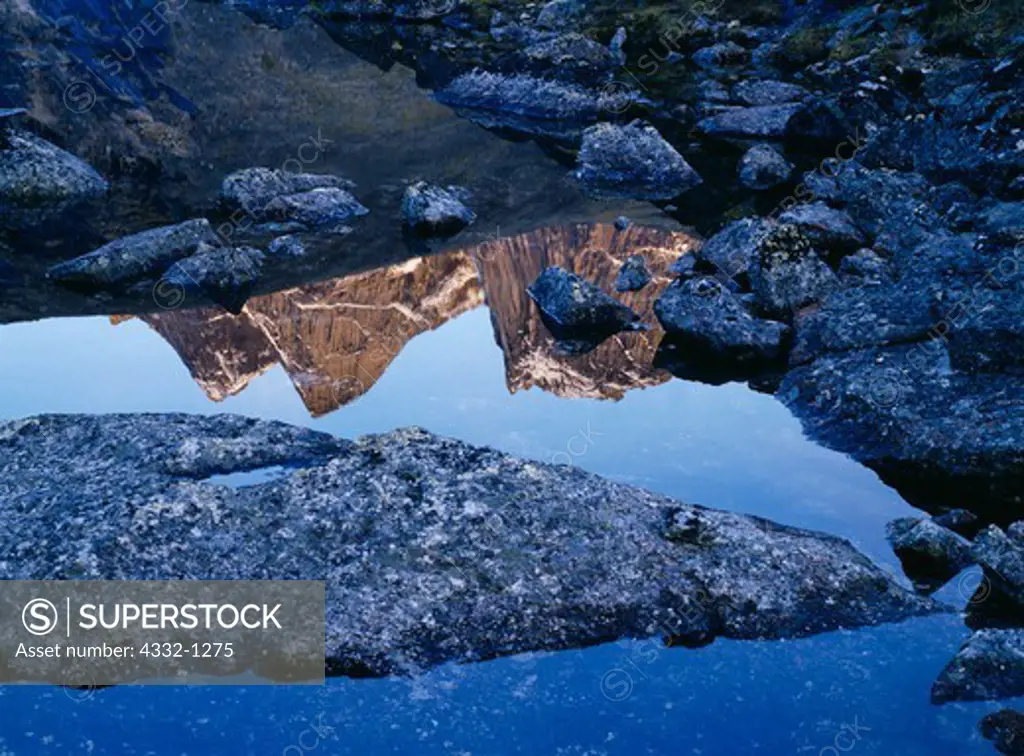 Arrigetch peaks reflected in alpine lake, Gates of the Arctic National Park, Brooks Range, Alaska.
