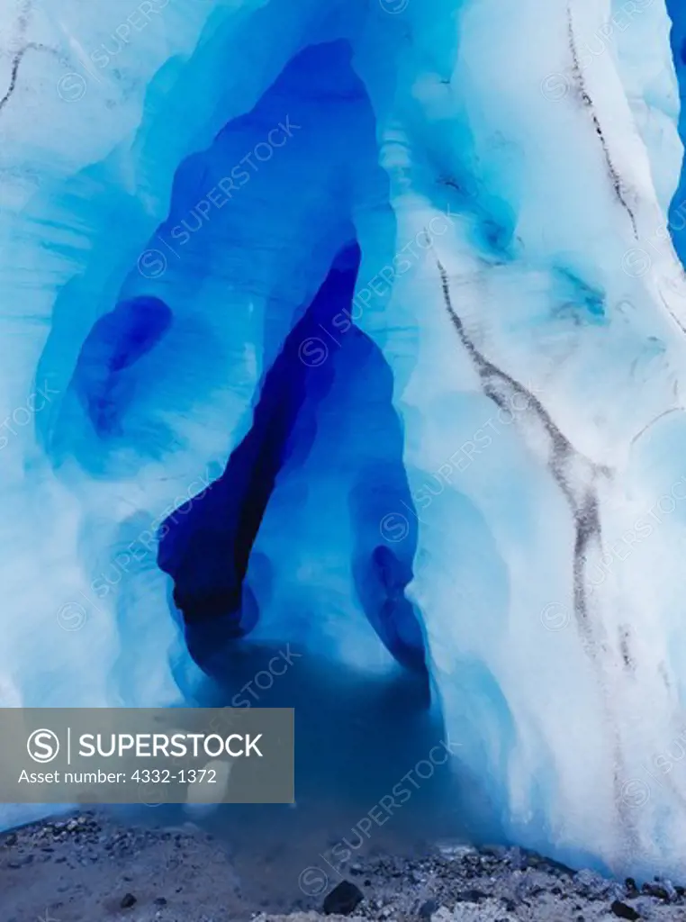 Ice cave sculpted in the toe of the glacier on the south shore of Holgate Arm, Aialik Bay, Kenai Fjords National Park, Alaska.