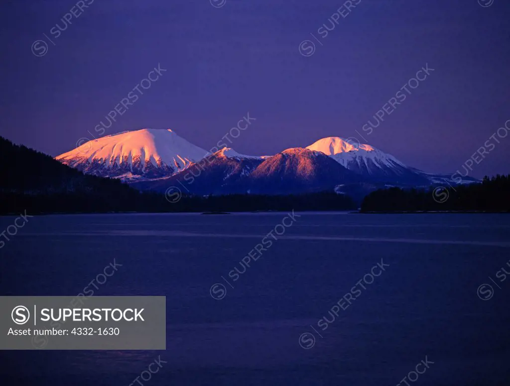 Composite cone of 3,271-foot Mount Edgecumbe volcano in first light of sunrise, Kruzof Island, Tongass National Forest, Alaska.