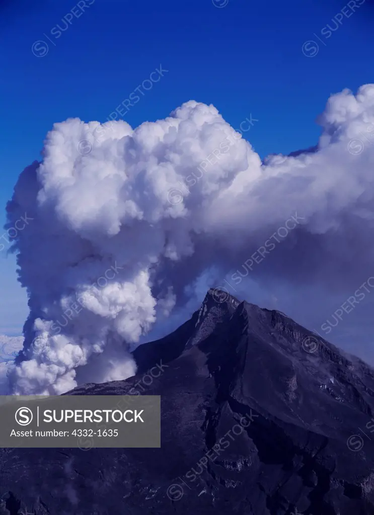 Vigorous steam and ash eruption of Redoubt Volcano during dome-building phase on April 5, 2009, viewed from ridge of the Chigmit Mountains west of Redoubt Volcano, Lake Clark National Park, Alaska.