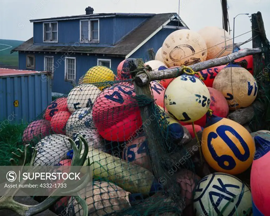 Collection of colorful fishing floats behind house in Saint Paul, Pribilof Islands, Bering Sea, Alaska.