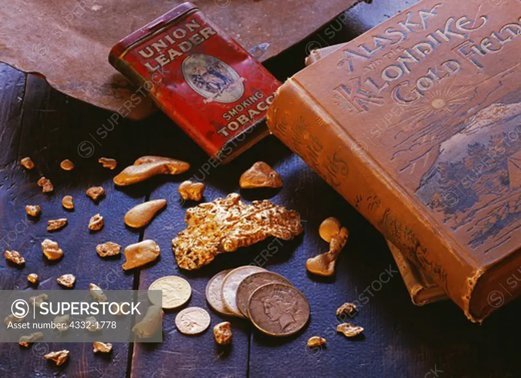 Placer gold mining still life with nuggets from Napoleon Creek and Livengood, Judd and Gail Edgerton, books and artifacts from Ron Wendt and coins from Fred Hirschmann,  Judd and Gail Edgerton Double J Mining, Wasilla, Alaska.