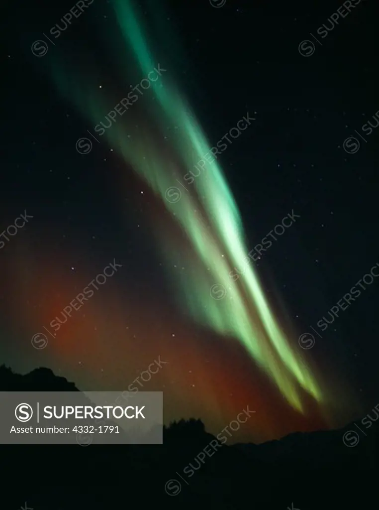 Green and red aurora over Wishbone Hill of the Talkeetna Mountains during geomagnetic storm in early morning hours of November 24, 2001, Alaska.