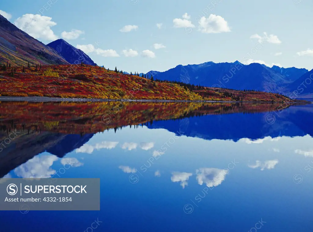 Autumn reflection in the glassy water of Lower Twin Lake, Lake Clark National Park, Alaska.