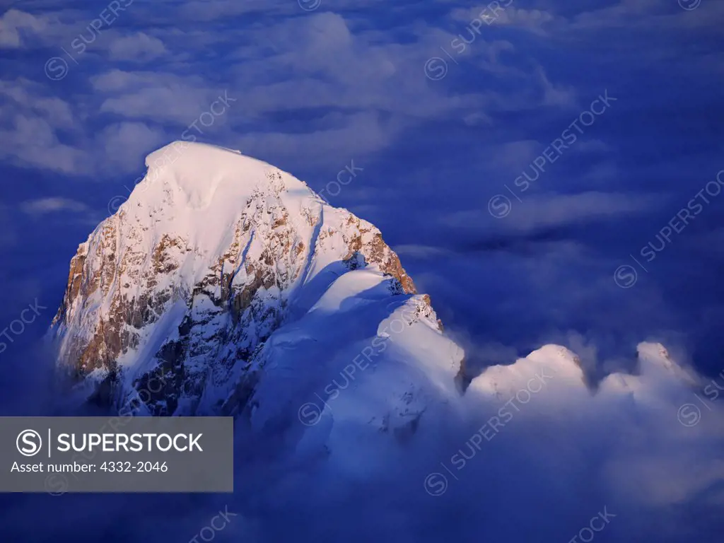 Aerial view of cloud bank enveloping peaks of the Alaska Range on the west side of the Great Gorge of the Ruth Glacier, Denali National Park, Alaska.
