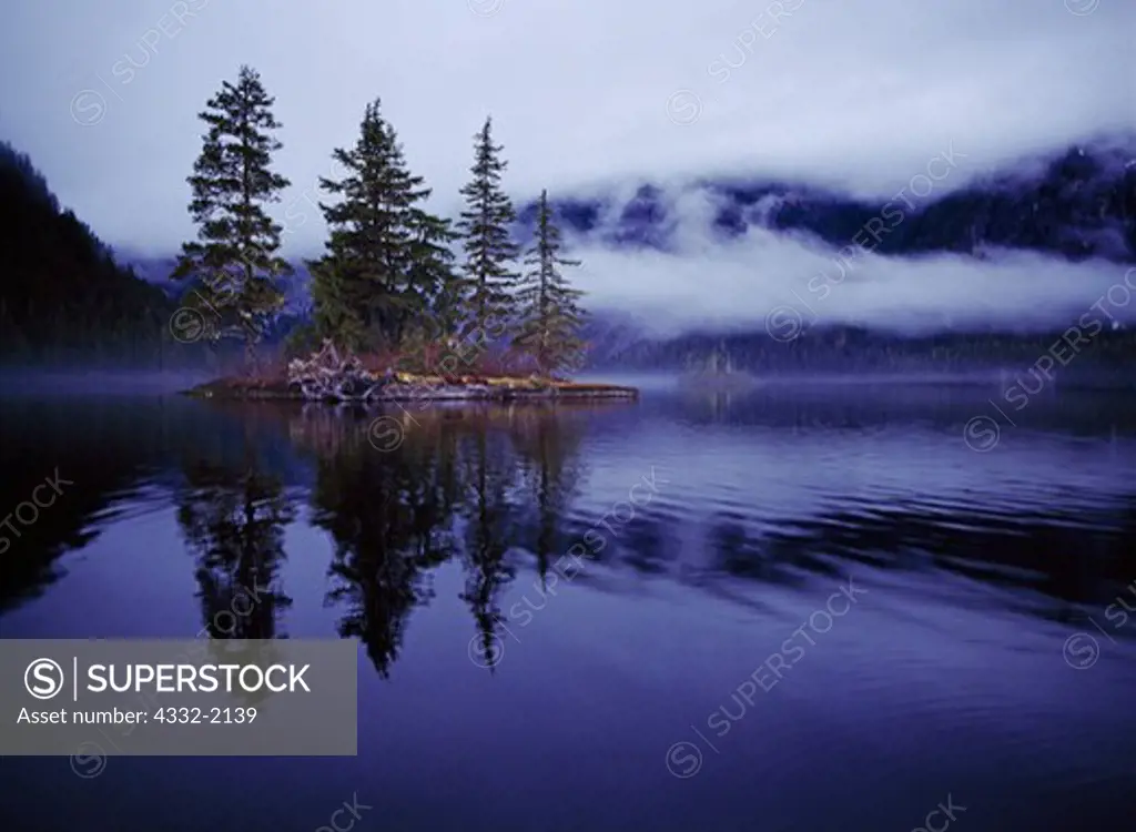 Misty, moody day with island silhouetted on Punchbowl Lake, Misty Fiords National Monument, Tongass National Forest, Alaska.