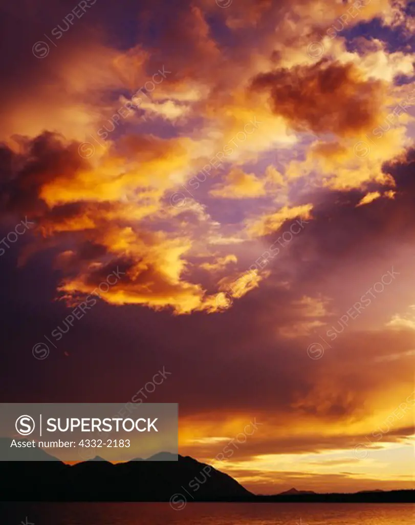 Sunset light illuminating departing storm over Twin Lakes, Lake Clark National Park, Alaska.