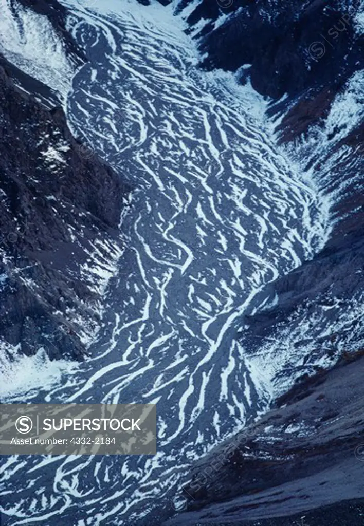 Wind-blown snow settled in braided stream channels, Neacola Mountains, Lake Clark National Park, Alaska.