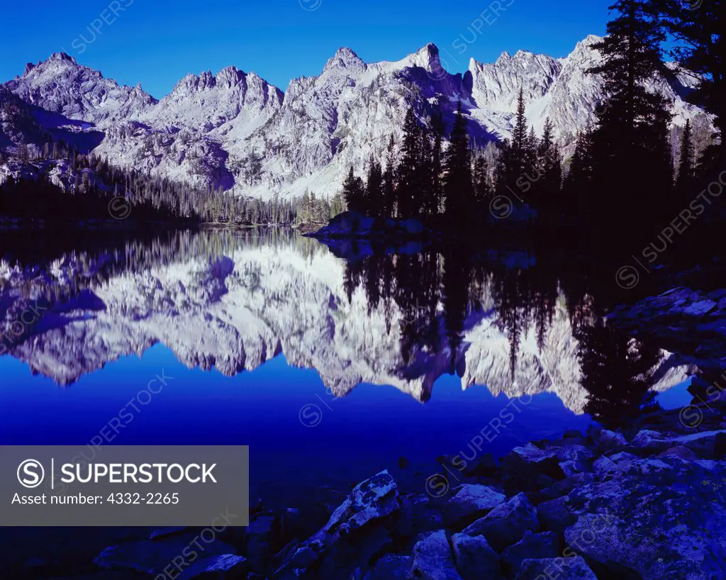 Sawtooth Mountains reflected in Alice Lake, Sawtooth Wilderness, Sawtooth National Forest, Idaho.