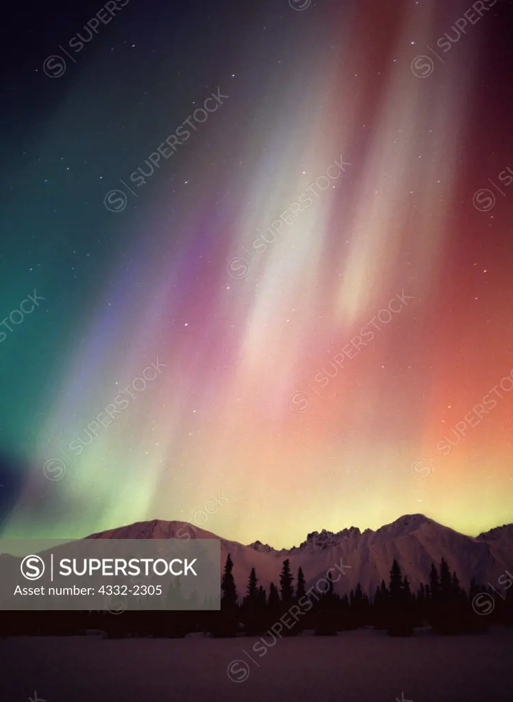 Beautiful green, red and purple aurora above the Talkeetna Mountains and Colorado Lake, geomagnetic storm during the early morning hours of March 31, 2001, Broad Pass, Alaska.