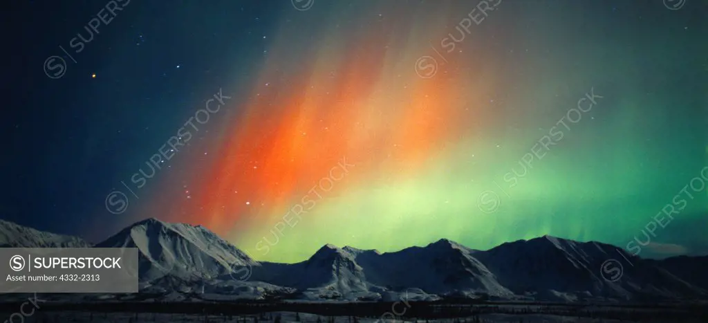 Beautiful red and green aurora over the Talkeetna Mountains during geomagnetic storm during early morning hours of October 28, 2001, Broad Pass, Alaska.