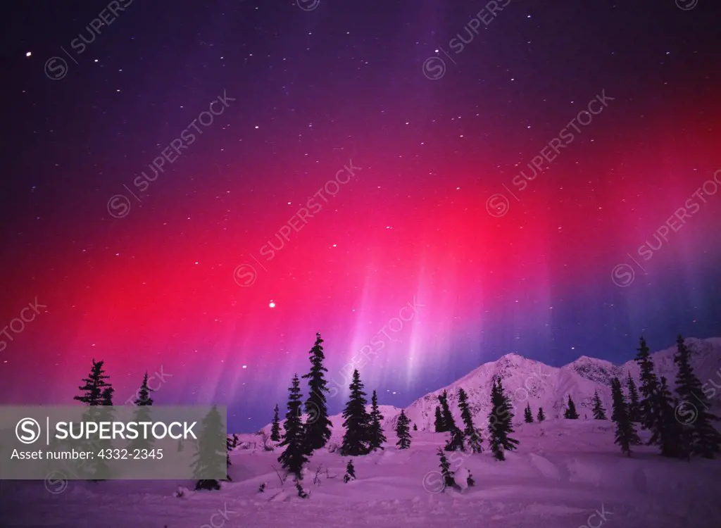 USA, Alaska, Red aurora borealis over Talkeetna Mountains