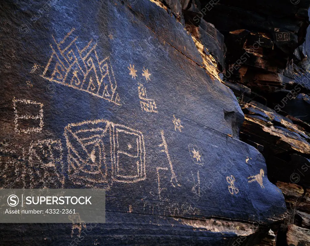 Rectiliniear Ancestral Pueblo petroglyphs incised in dark desert varnish, tributary to the Little Colorado River, Arizona.   SC