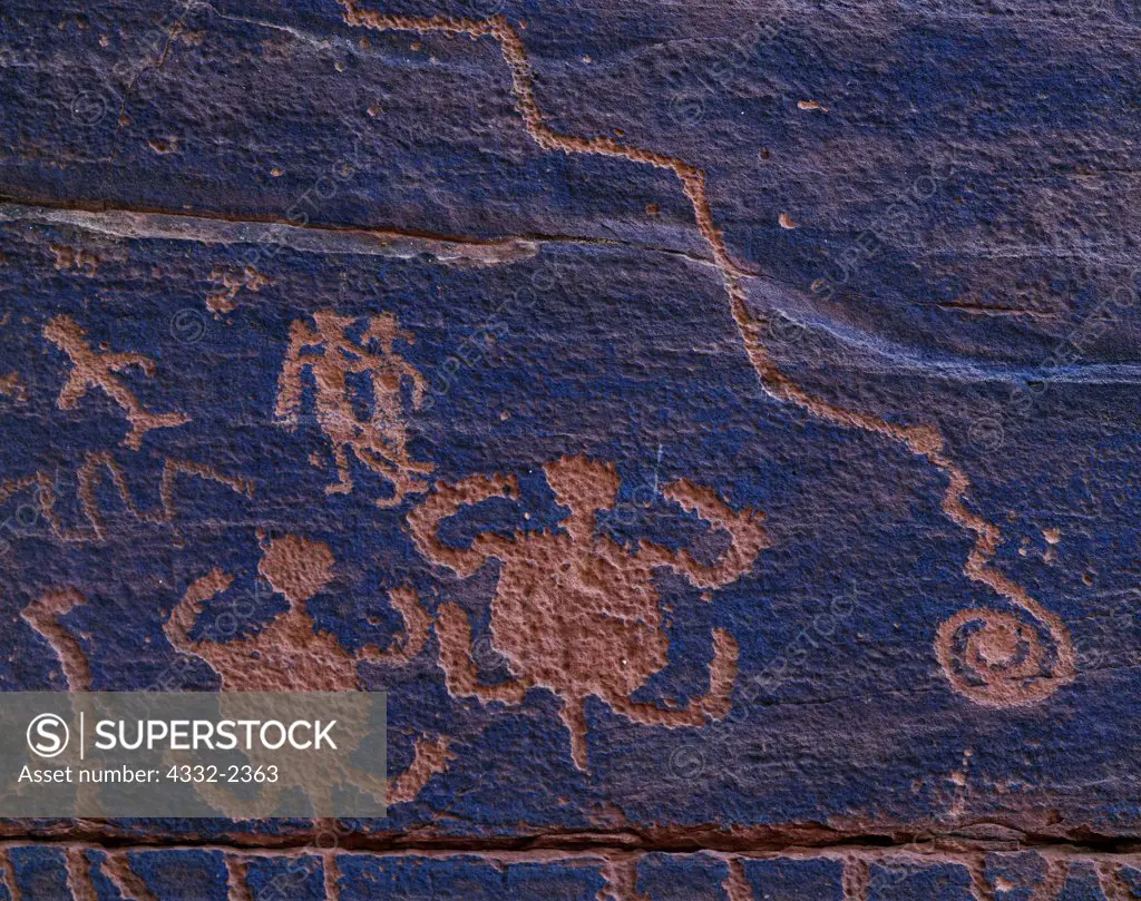 Southern Sinagua petroglyphs on a sandstone face, Coconino National Forest, Arizona.