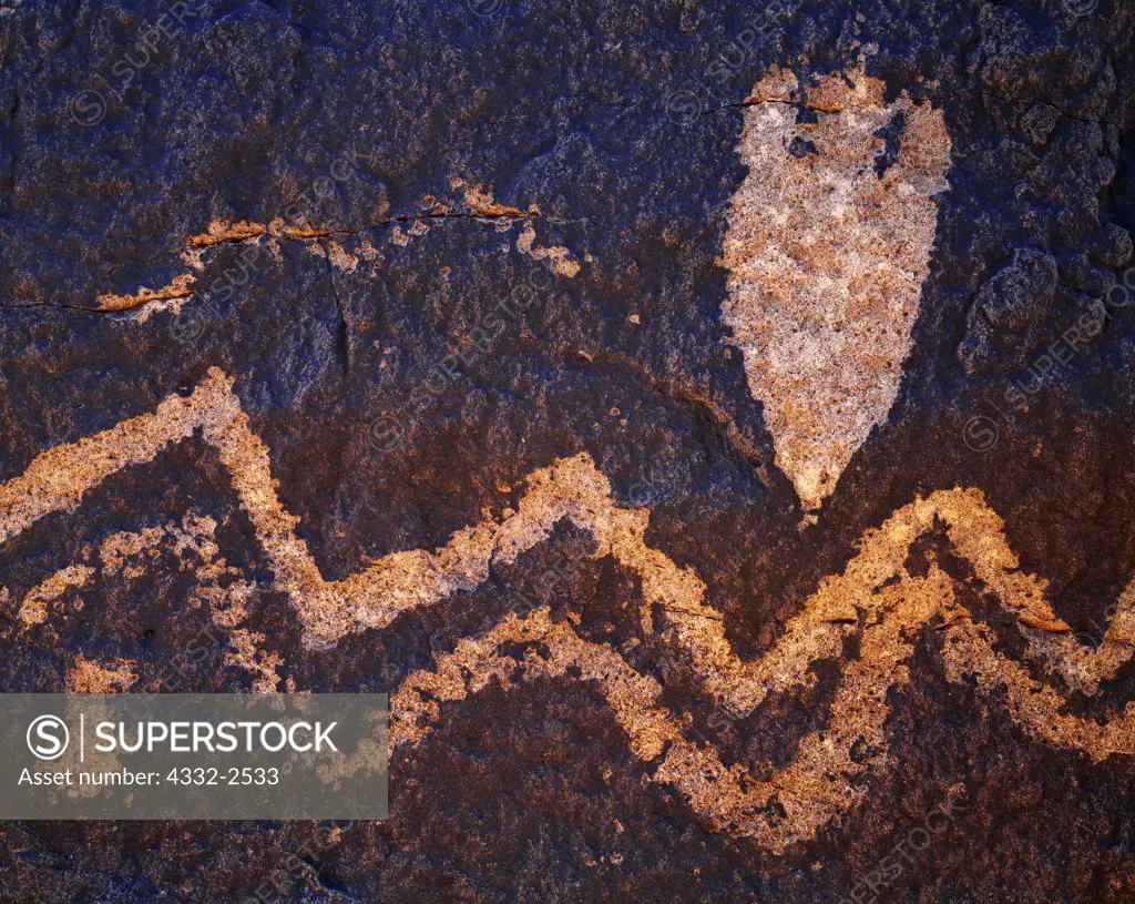 Archaic hunting-gathering petroglyphs of the Chihuahuan Desert featuring spear point design and wavy lines, Hudspeth County, Texas.  AC2