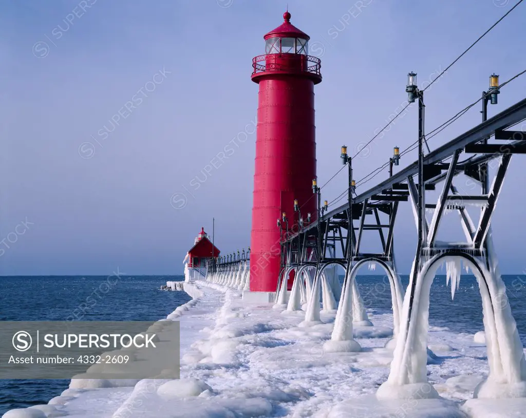 Ice-covered catwalk leading to Grand Haven Inner and South Pierhead Lighthouses, Grand River, Lake Michigan, Grand Haven State Park, Grand Haven, Michigan.