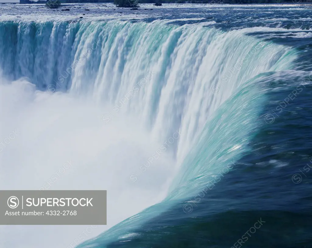 The Niagara River spilling over Horseshoe Falls, Niagara Falls, Ontario, Canada.