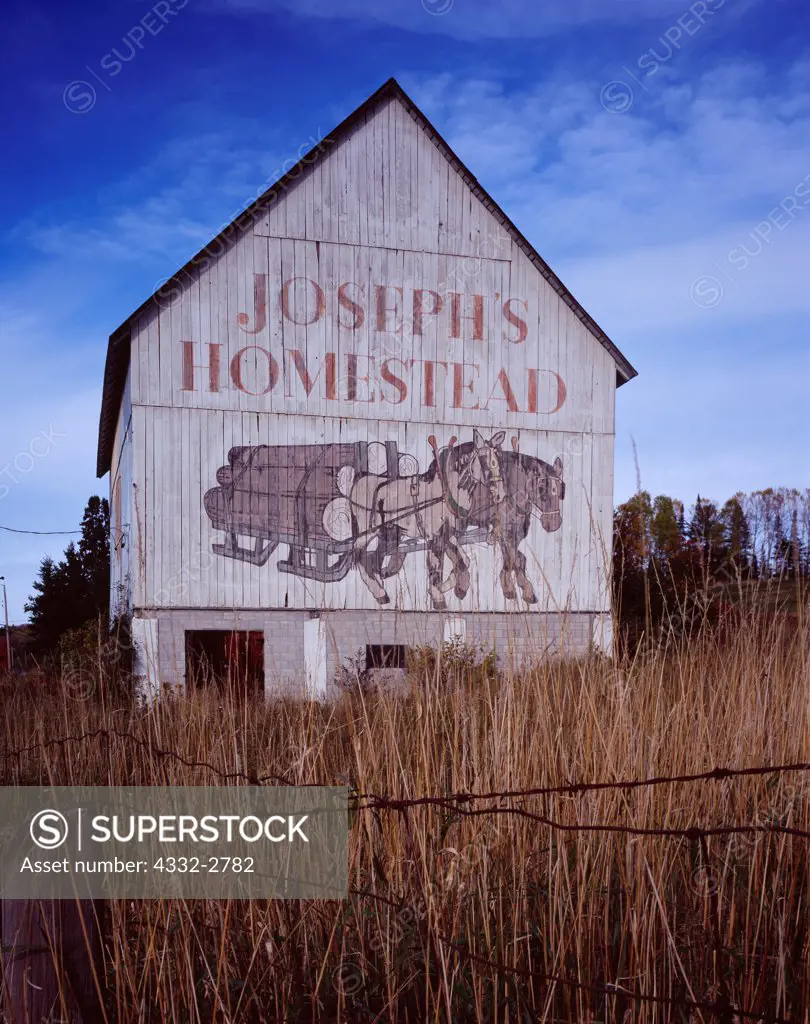 'Joseph's Homestead' painted on side of barn along Highway 17N near the Goulais River in northern Ontario, Canada.