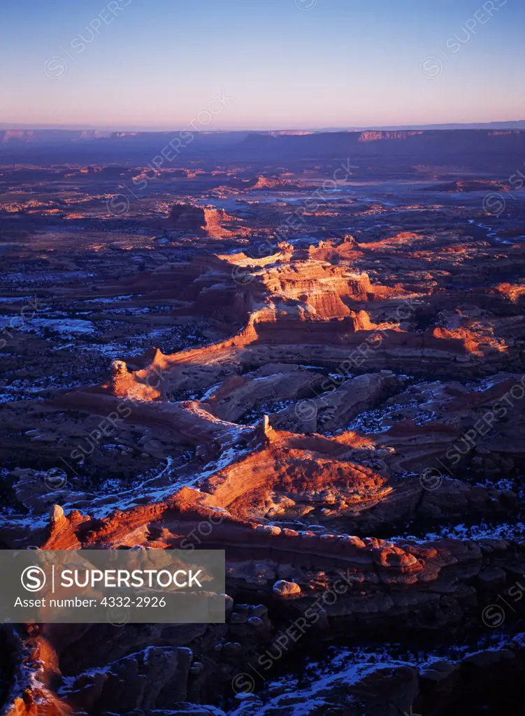 Aerial view of winter sunrise looking north between Squaw Canyon and Lost Canyon toward Squaw Butte, Needles District, Canyonlands National Park, Utah.