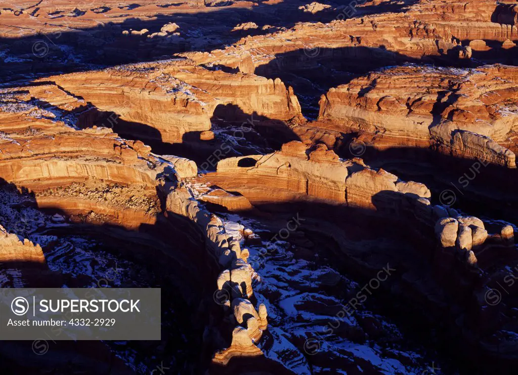 Aerial view of morning light illuminating Castle Arch, Horse Canyon, The Needles, Canyonlands National Park, Utah.
