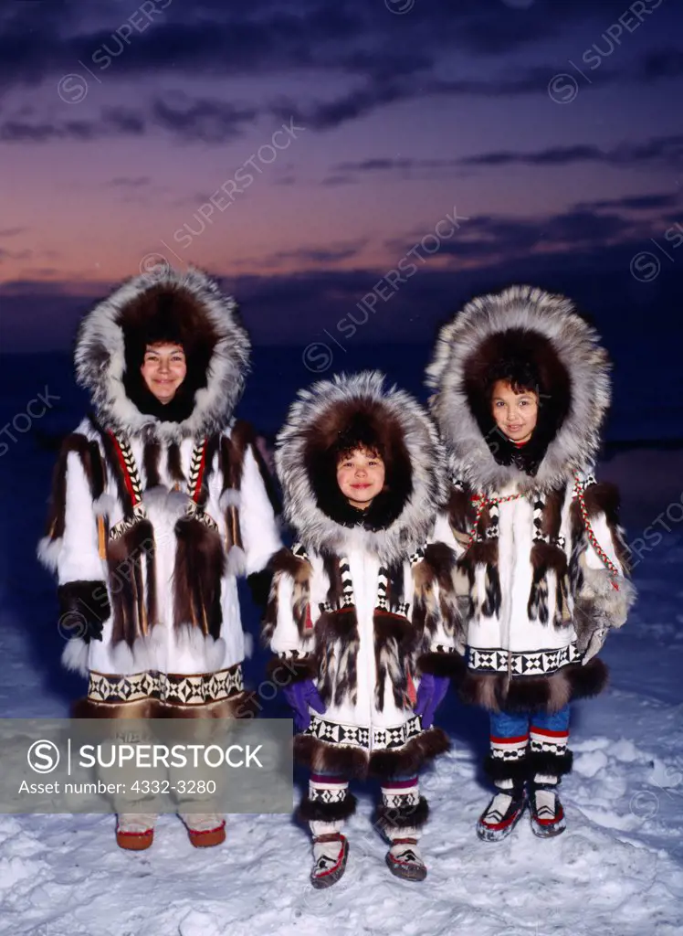 USA, Alaska, Barrow, Family wearing Eskimo Parkas at Arctic Ocean Coast