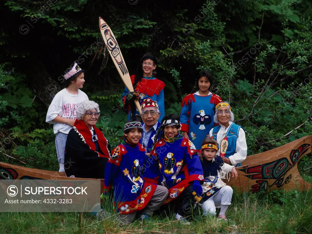 USA, Alaska, Yakutat, Tlingit village, Portrait of St Elias Dancers in carved cedar canoe. Fourth of July, 1991, (Please note: Licensing of this photograph requires a small extra fee be paid that goes to help support the St. Elias Dancers. Contact Fred Hirschmann for information - 907-373-3750)