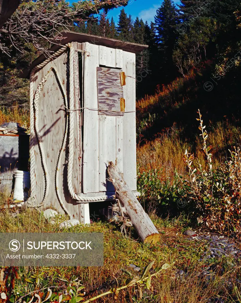 USA, Alaska, Kenai Peninsula, Outhouse with halibut outline done in rope nearby shore of Anchor Point