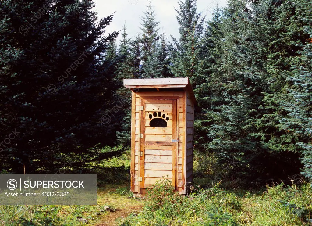USA, Alaska, Lake Clark National Park, Silver Salmon Creek, National Park Service Ranger Cabin, Outhouse with dutch door and Brown Bear paw window