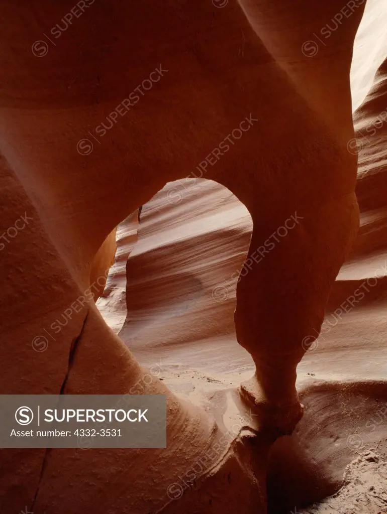 USA, Arizona, Colorado Plateau, Pothole arch in slot canyon