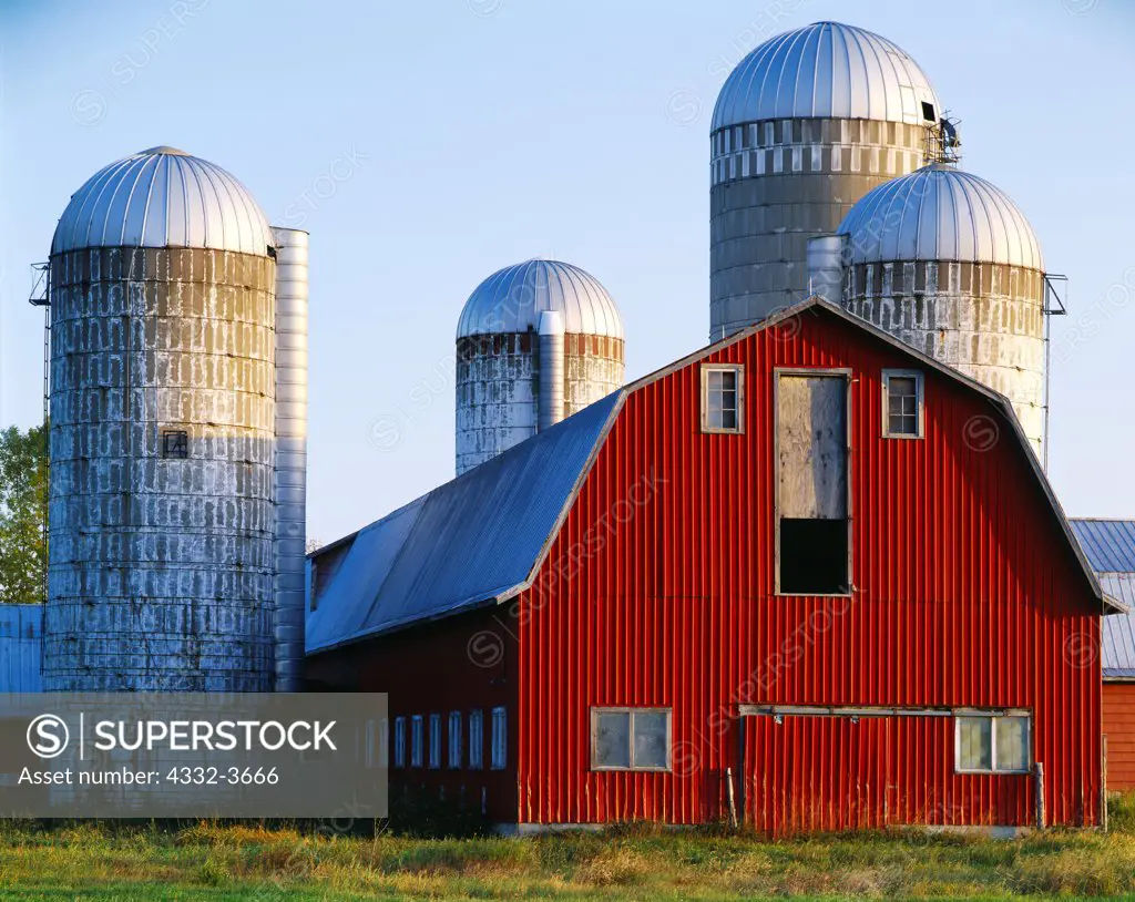 USA, Vermont, Milking Barn with silos at Lake Champlain area near Alburg