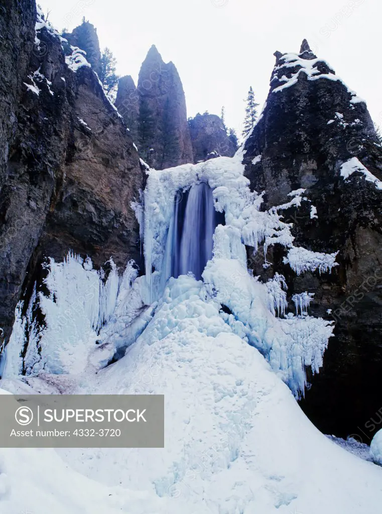 USA, Wyoming, Yellowstone National Park, Tower Fall draped in ice during winter