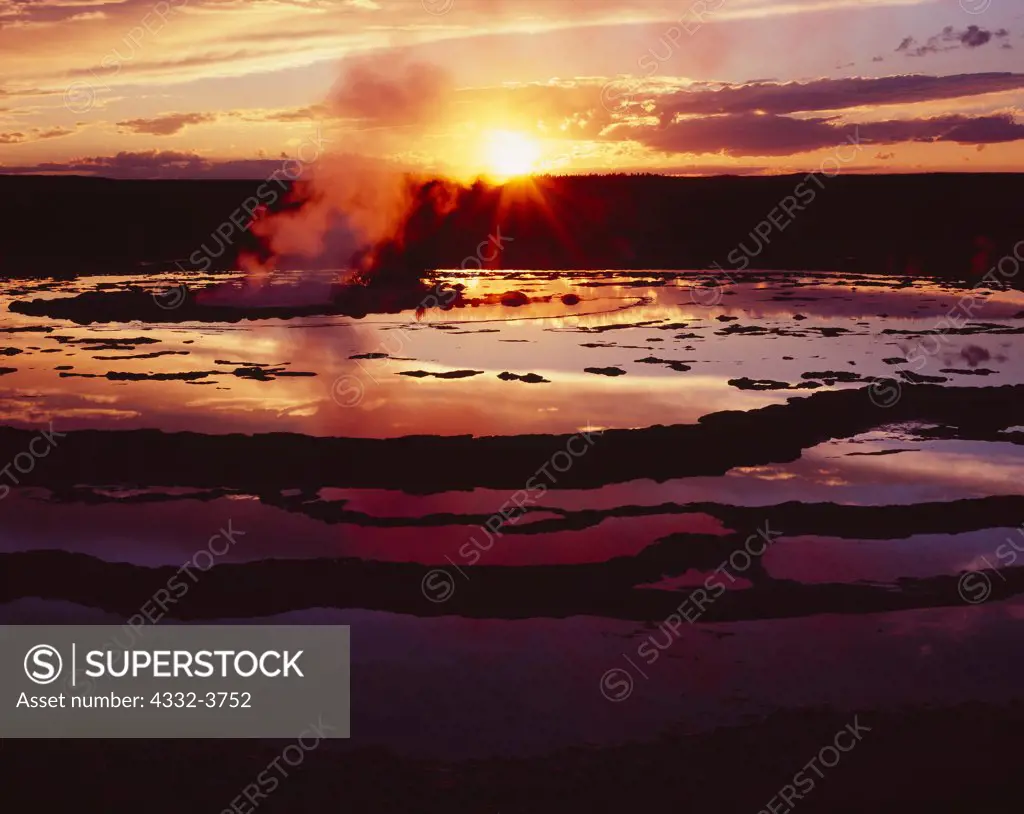 USA, Wyoming, Yellowstone National Park, Lower Geyser Basin, Sunset reflected in geyserite-lined pool of Great Fountain Geyser
