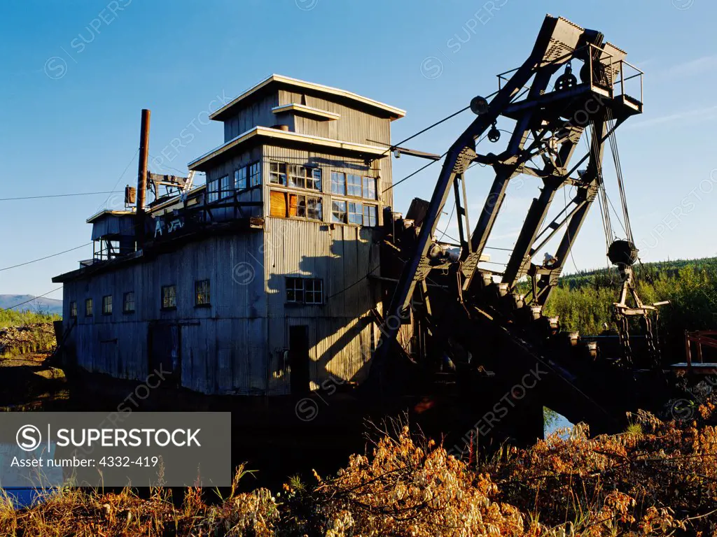 A dredge once used for placer gold mining sits abandoned on Coal Creek, Yukon-Charley Rivers National Preserve, Alaska.