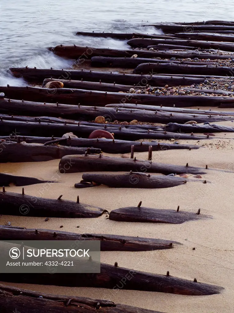 Shipwreck of Mary  Jarecki, a wooden bulk freighter hauling iron ore that wrecked near Au Sable point on July 4, 1883.  Long oak keelson studded with iron treenails visible along shore of Lake Superior at Twelvemile Beach, Pictured Rocks National Lakeshore, Upper Peninsula of Michigan.