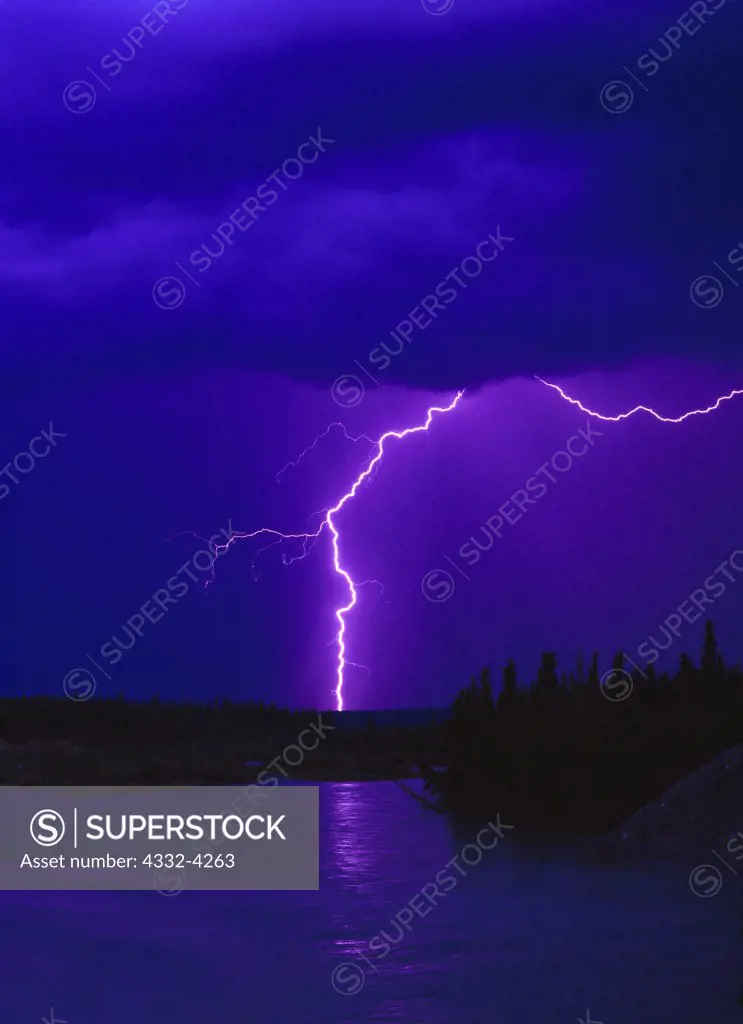 Lightning from a late summer thunderstorm over the Kluane River, Yukon Territory, Canada.