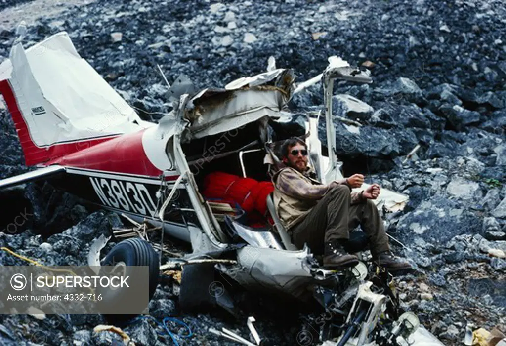 Bill Reisland announcing 'We'll be taking off as soon as I find the Yoke and the Rudder Peddles!'  Remains of Cessna 182 that crashed in Merrill Pass in the Alaska Range on 2-9-86.  The pilot, Michael Harbough survived with only injury being a broken ankle.  Lake Clark National Park, Alaska.