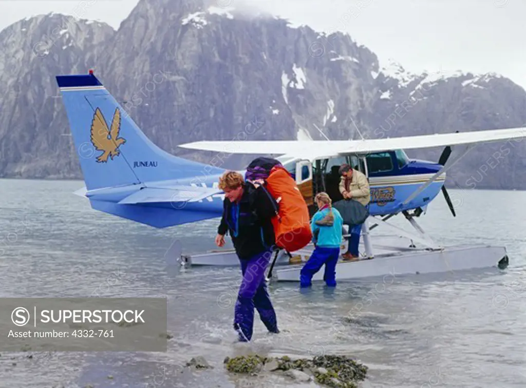 Chief Pilot for Wings of Alaska, Cliff Westbrook, dropping off Ed Gillet and friend for Kayak trip in Muir Inlet, Glacier Bay National Park, Alaska.
