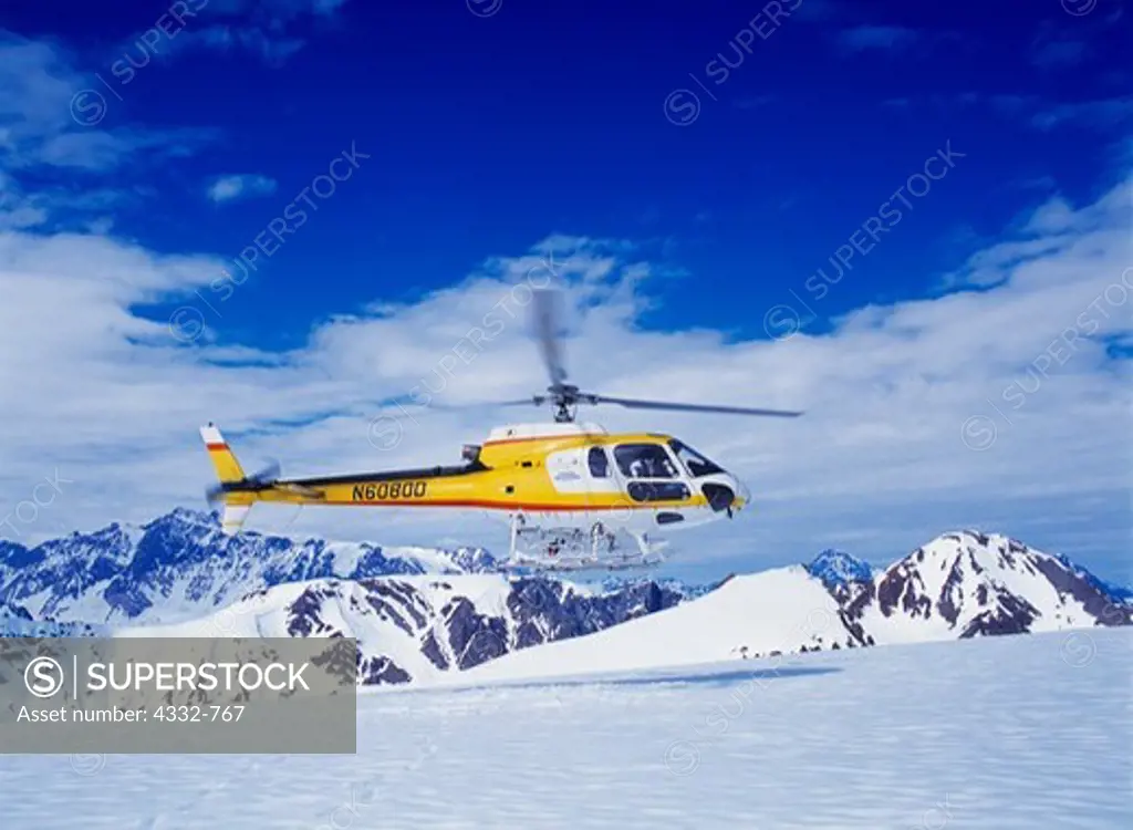 Coastal Helicopters' AStar 350B ferrying heli-skiers in the Tordrillo Mountains, Chugach Powder Guides and Winterlake Lodge's Kings and Corn week in June, Alaska.